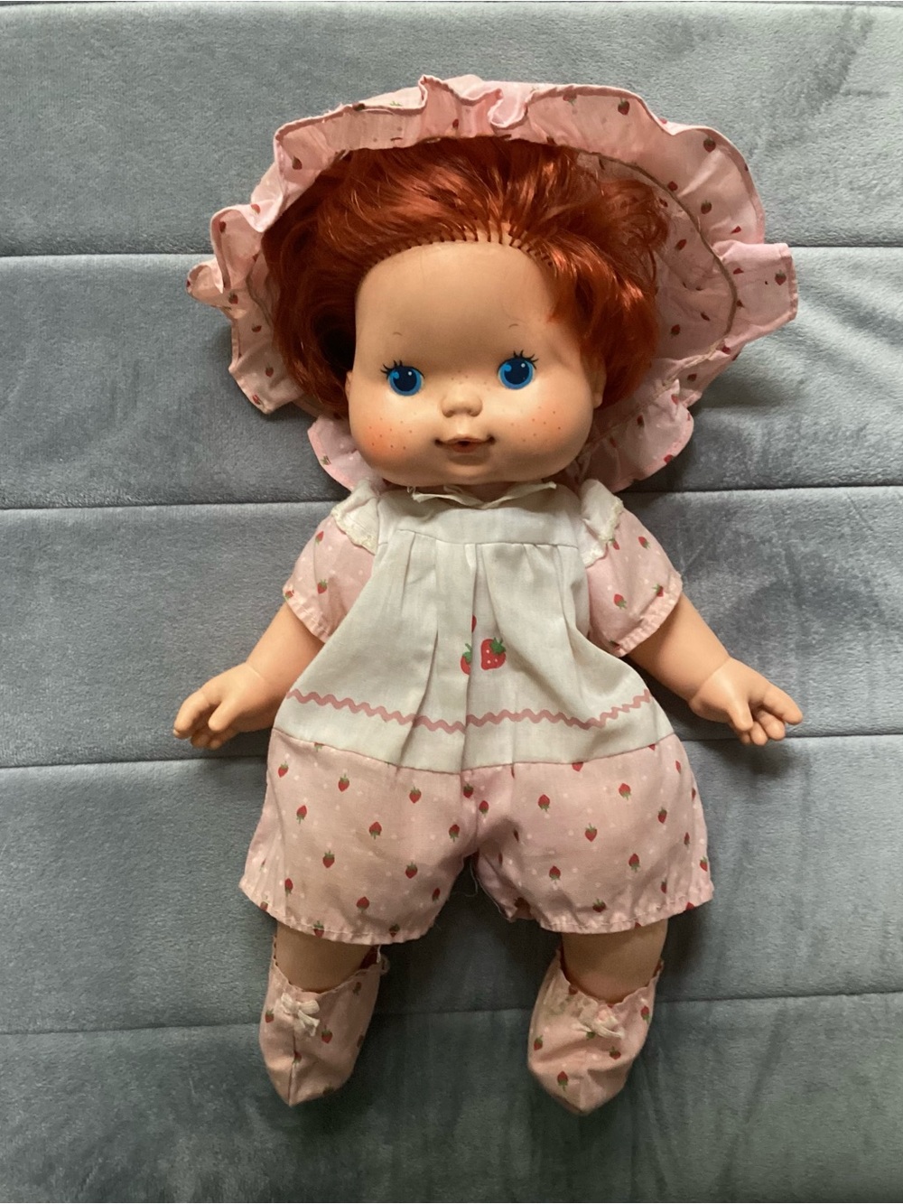 Red-haired Baby Doll in Pink Strawberry Outfit